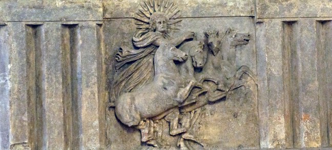 Chariot with son god, displaying radiate iconography of sun. Nero pictured with rays of sun to imitate the sun god Helius, perhaps to proclaim that he was Neos Helius, a new manifestation of the sun god. This artifact is located in the Pergamum Museum, Berlin, Germany.  © copyright holder of this work is Richard E. Oster.  Page 79, figure 42.  Incorrectly attributed in the book (p. 222) to The State Hermitage Museum, St. Petersburg, Russia.
