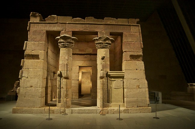 This Temple of Dendur was built during the early reign of Augustus in ancient Nubia as a site for worship of Isis and other Egyptian deities. The reason for its construction was to establish Roman hegemony on this border region along the Nile. On some of the walls the Roman Emperor Augustus is depicted as a Pharaoh worshipping the Egyptian gods and goddesses. The temple was relocated to the Metropolitan Museum of Art in New York City and was erected in the Museum in 1978.  © copyright holder of this work is Richard E. Oster.  Page 33, figure 15. 